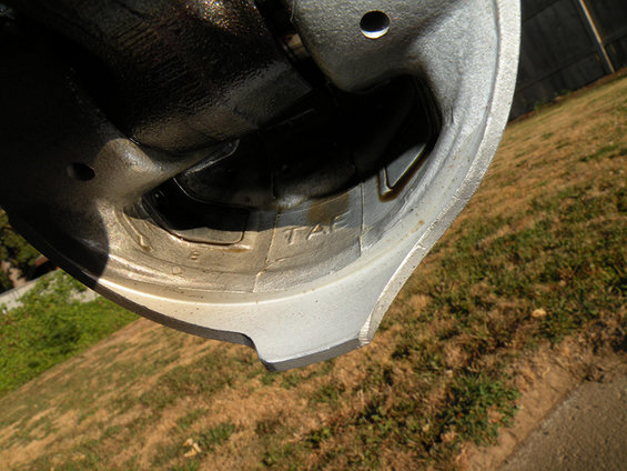 Close-up of engine part with 'TAE' stamped on it