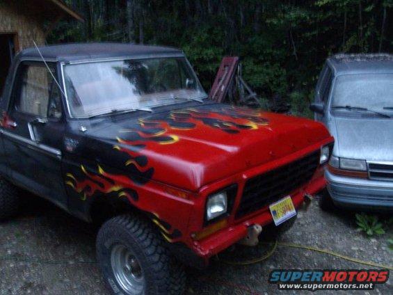 Red hood with flame decals on a 1978 Ford Bronco, front view