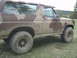 1985 Ford Bronco - This Ford Bronco features a camouflage paint scheme and appears to be from the early 1980s.