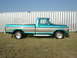 1979 Ford F-150 - This 1979 Ford F-150 pickup truck features a distinctive teal and silver two-tone paint scheme.