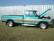 1979 Ford F-150 - Two-tone 1979 Ford F-150 pickup truck with the hood open, parked on grass.