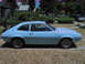 1972 Ford Pinto - A light blue 1972 Ford Pinto coupe is shown from the side in a residential setting.