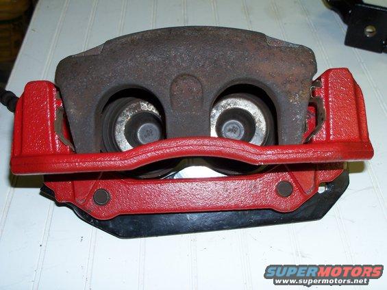 crown-vic-brake-caliper-assembly-3.jpg The caliper is offset somewhat on the bracket but once installed the rotor lines up perfectly with the brake pads, about a 1/16" of the rotor is above the pads once installed. New caliper,  mounting bracket and associated hardware will be used once the fabricating is done.