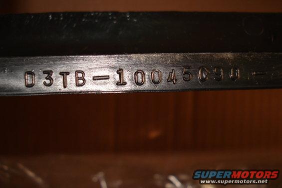 Part with stamped numbers D3TB-10045090