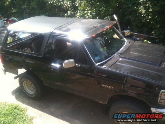1993 Ford Bronco with soft top removed, parked outdoors