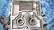 1968 Ford Ranchero - Internal view of a carburetor, revealing its complex mechanical structure and dual intake ports.