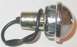 1979 Ford Bronco - A close-up view of a chrome and white light bulb assembly with black wires.