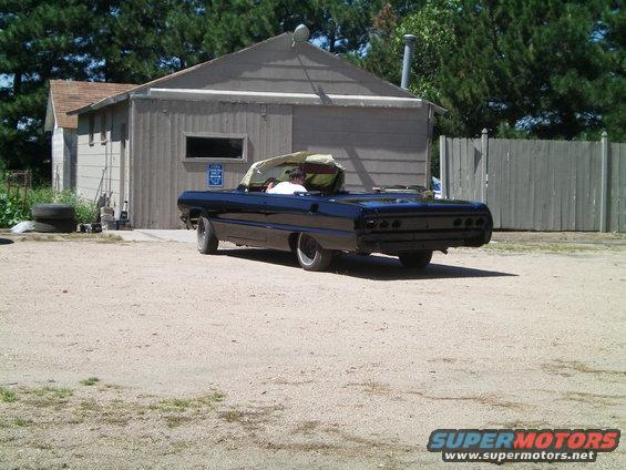 Black 1964 Chevrolet Impala convertible, rear view