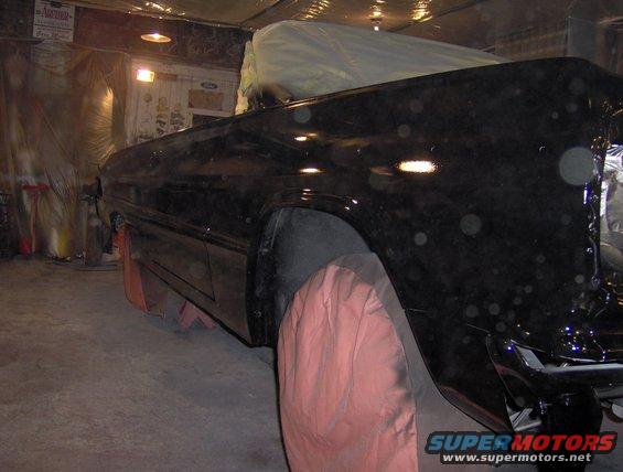 1964 Chevrolet Impala side view in garage, covered in dust spots