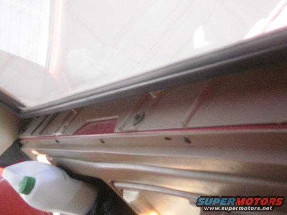 Interior trim panel and a bottle with a green cap