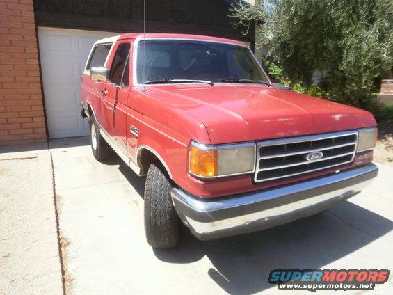 Red 1991 Ford Bronco parked in driveway