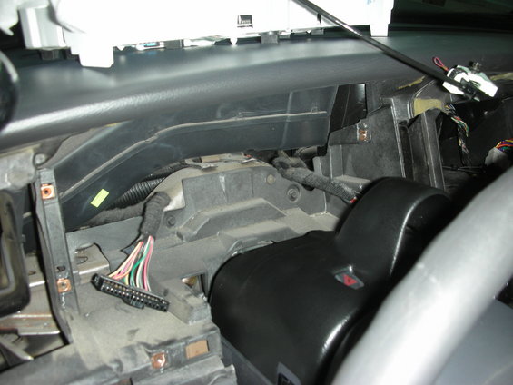 Dashboard wiring harness and steering column components exposed