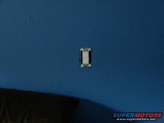light switch on blue wall