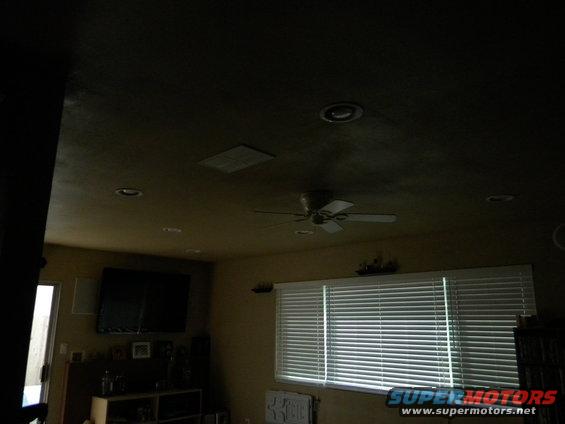 Interior room with blinds, TV, and ceiling fan