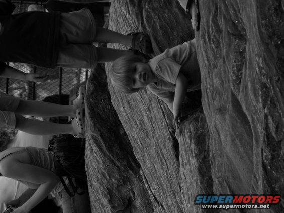 kids climbing on large rocks