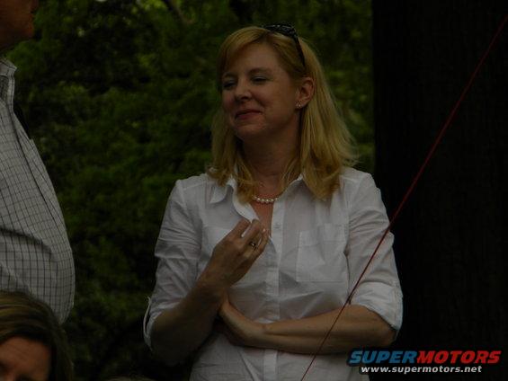 woman in white shirt and pearl necklace