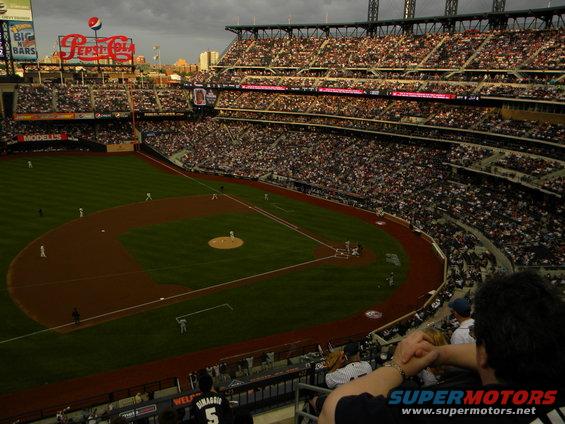 Baseball stadium filled with spectators, Pepsi-Cola sign prominent