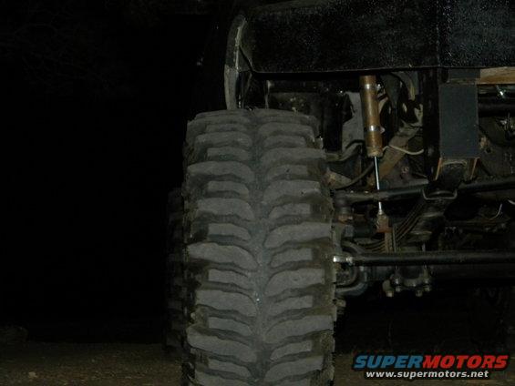 Close-up of a large off-road tire and suspension system