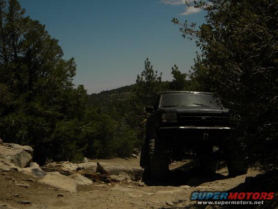 Black 1992 Ford Bronco on a rocky trail
