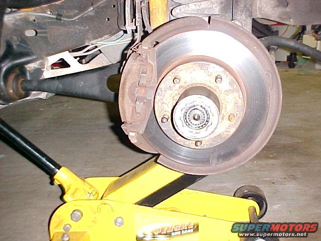 Front wheel hub and brake assembly on a yellow jack