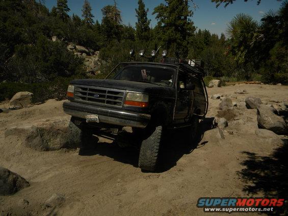 1992 Ford Bronco 3q-front view, black, off-roading