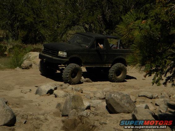 Black 1992 Ford Bronco on rocky terrain