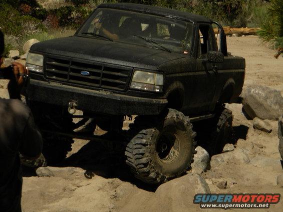 1992 Ford Bronco navigating a rock crawl course