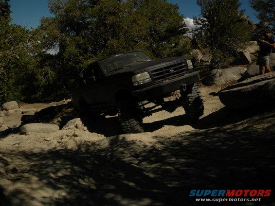 Black 1992 Ford Bronco on a rocky off-road trail