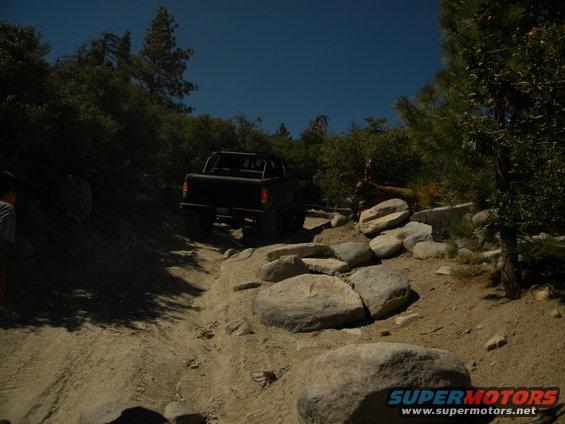 Black 1992 Ford Bronco on a rocky, off-road trail
