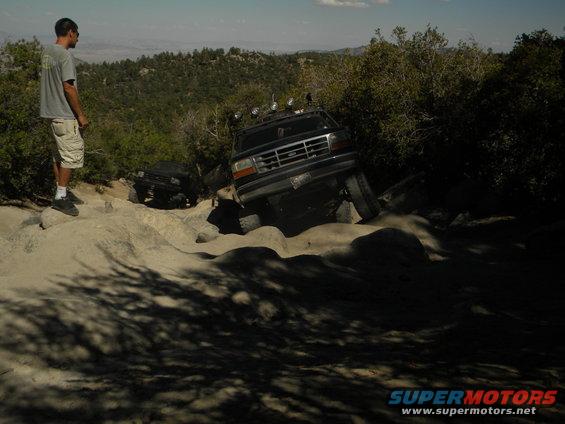 Black 1992 Ford Bronco navigating rocky terrain