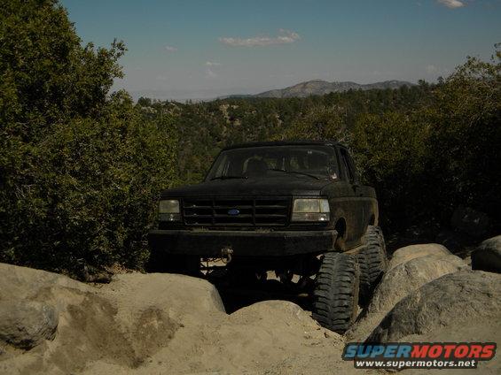 Black 1992 Ford Bronco on a rocky trail, front view