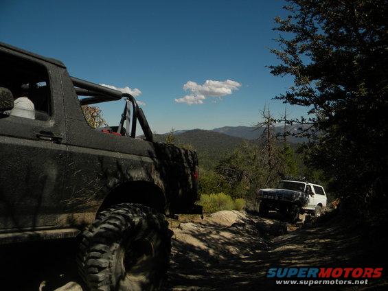 1992 Ford Bronco and another Bronco on a mountain trail