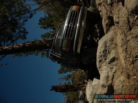 Dark 1992 Ford Bronco climbing rocks