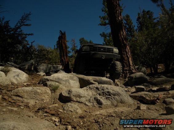 Black 1992 Ford Bronco on rocks
