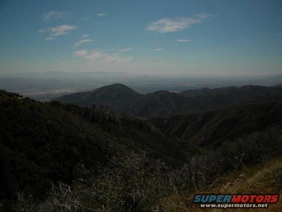Mountain landscape with distant haze and clouds