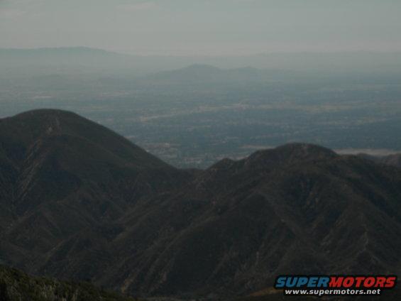 Hazy mountain range with a valley in the distance