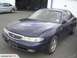 1993 Mazda MX-3 - This dark blue sedan has a distinctive grille and body style, but does not match the claimed 1993 Mazda MX-3.