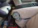 1996 Ford Bronco - The interior of a vehicle is shown, with seats and various items stored in the back.