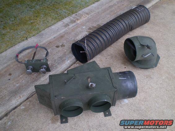 Heater core unit, flexible ducting, and elbow piece laid out on concrete