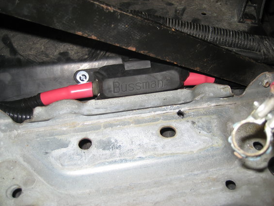Close-up of a Bussmann fuse holder with red wire terminals