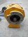 1988 Ford Bronco - This yellow transfer case has a visible shifter boot and a splined output shaft.