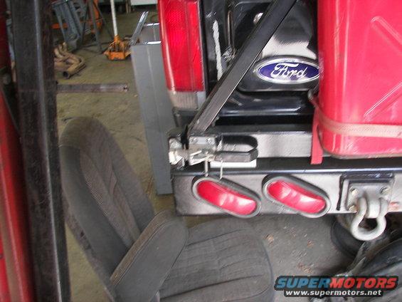 Rear bumper with Ford emblem and red gas can