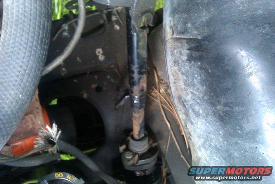 close-up of steering column and hoses under hood