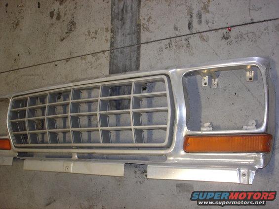 Front grille and amber turn signal assembly from a truck