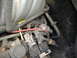 1995 Ford F-150 - A close-up view of the engine bay shows various wires, connectors, and hoses.