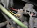 1995 Ford F-150 - A close-up view of an engine's wiring harness, showing various colored wires and connectors.