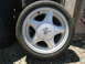1972 Ford Pinto - A close-up view of a single vehicle wheel with a prominent brand logo.