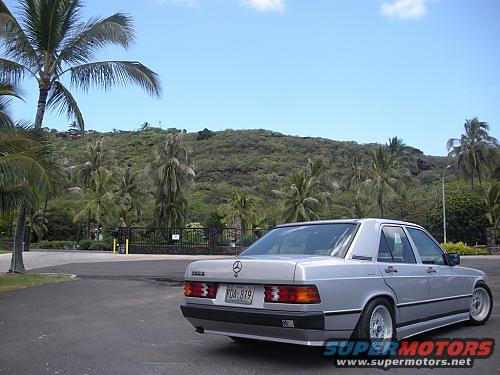Silver sedan parked on asphalt, rear quarter view. License plate PDA 819