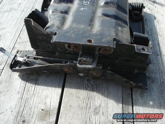 Black seat mounting bracket with visible date '9.15.'