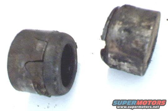 ujoint03.jpg Side view of caps. One on the left is cracked and the one on the right has a small chunk gone. 